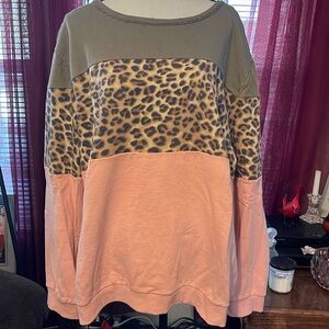 3X sweatshirt, animal print along with 2 other colors. Neck is distressed.